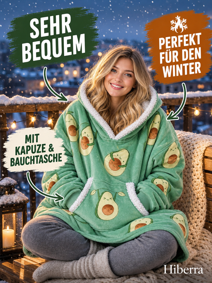 Frau sitzt auf dem Balkon im Hiberra Kuschelhoodie in Avocado-Print – Farbe Avocado-Print