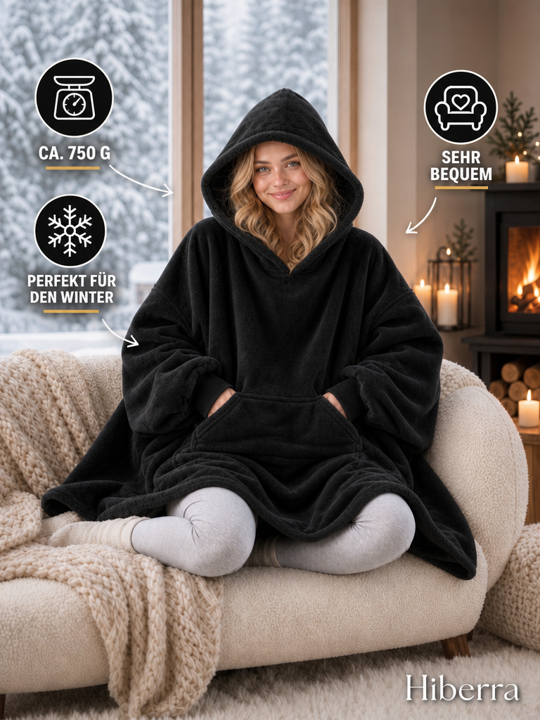Frau in der schwarzen Hiberra Hoodie-Decke auf dem Sofa, ca. 750 g – Farbe Schwarz